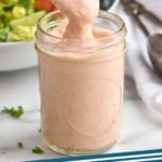 pinterest graphic of Russian dressing being spooned up from a mason jar