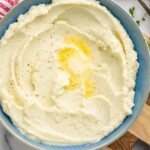 overhead of a bowl of mashed cauliflower with butter melting on it - 25