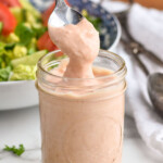 Russian dressing being spooned up from a mason jar