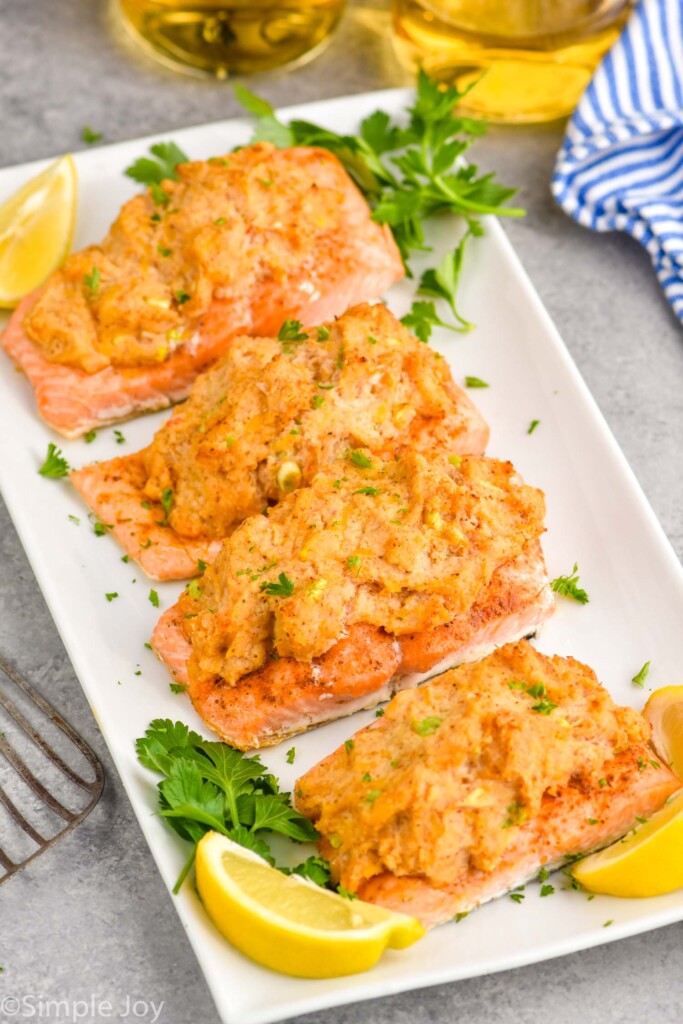 four pieces of salmon stuffed with crab on a platter