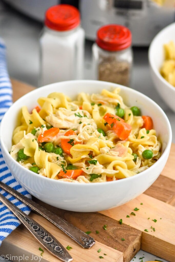 white bowl with slow cooker chicken and noodles