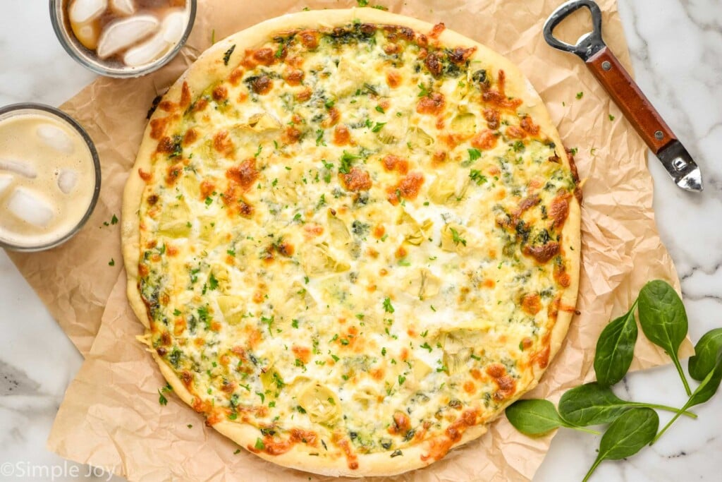 overhead picture of a pizza made with spinach