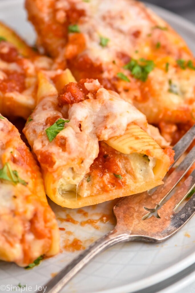 close up of a cheese stuffed shell cut in half