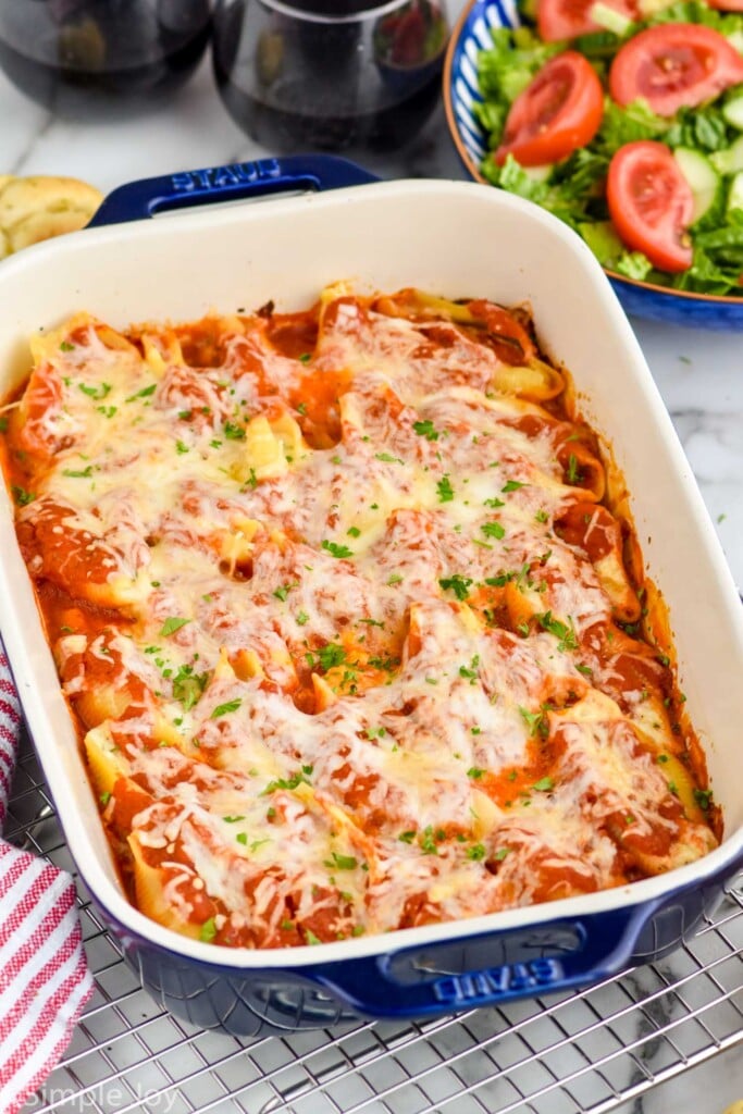 side view of a pan of stuffed shells recipe