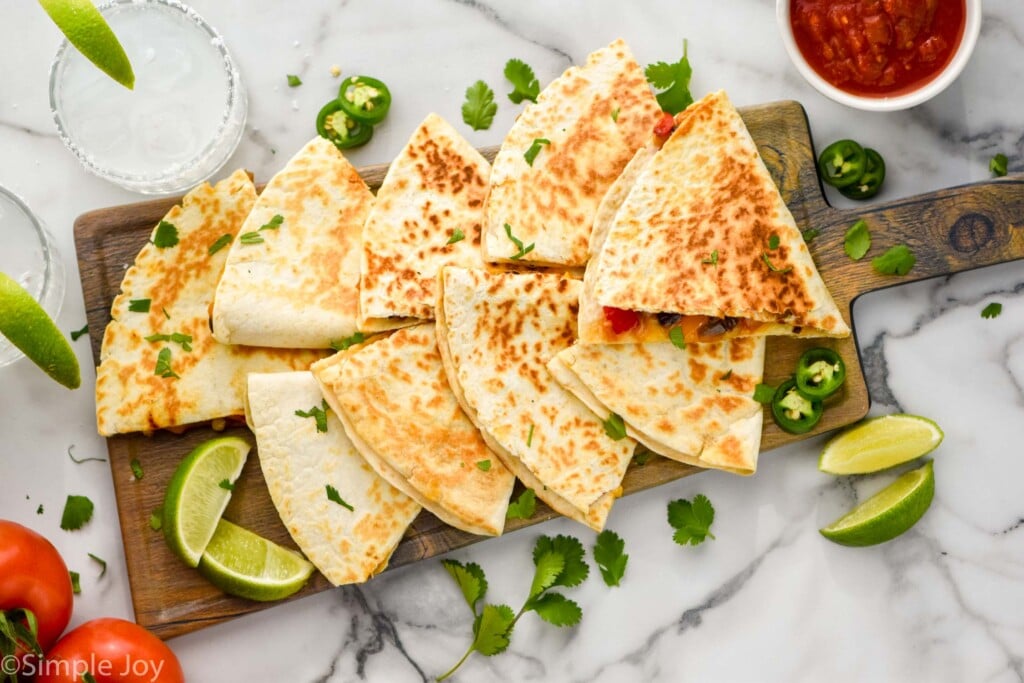 overhead view of cut up vegetarian quesadilla on a platter