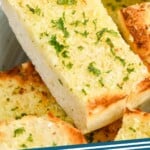 pinterest graphic of close up of a piece of easy garlic bread