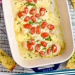 pinterest graphic of overhead picture of a baking dish full of pesto chicken