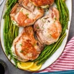 pinterest graphic of overhead of a platter of stuffed pork chop recipe