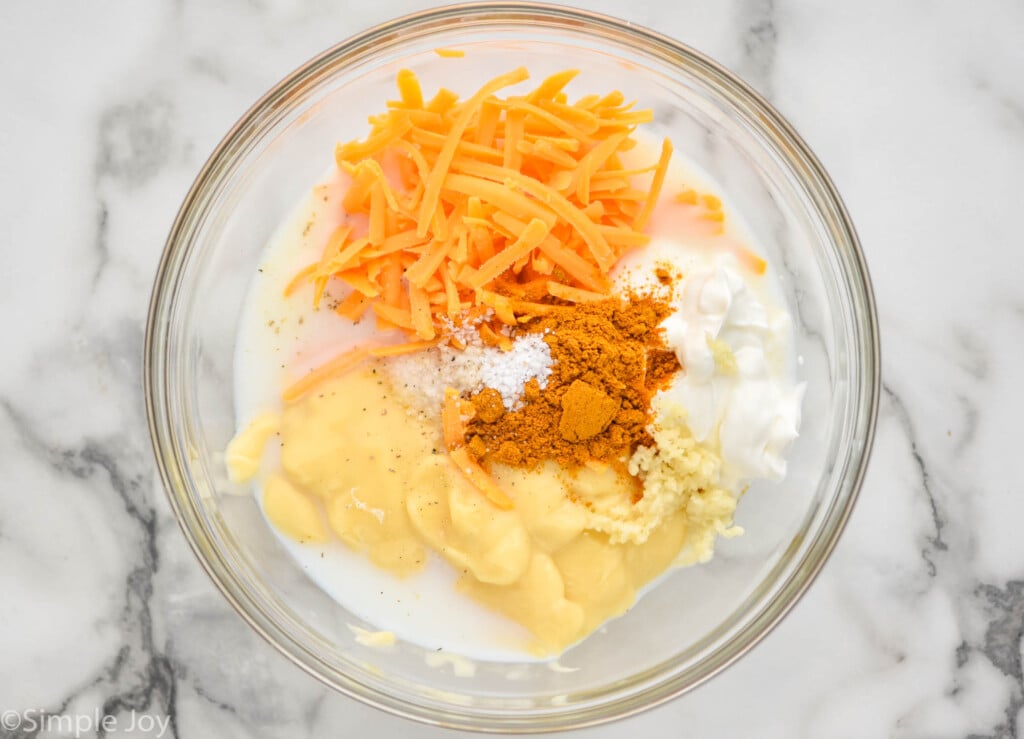 overhead of a bowl of ingredients to make sauce for chicken divan casserole