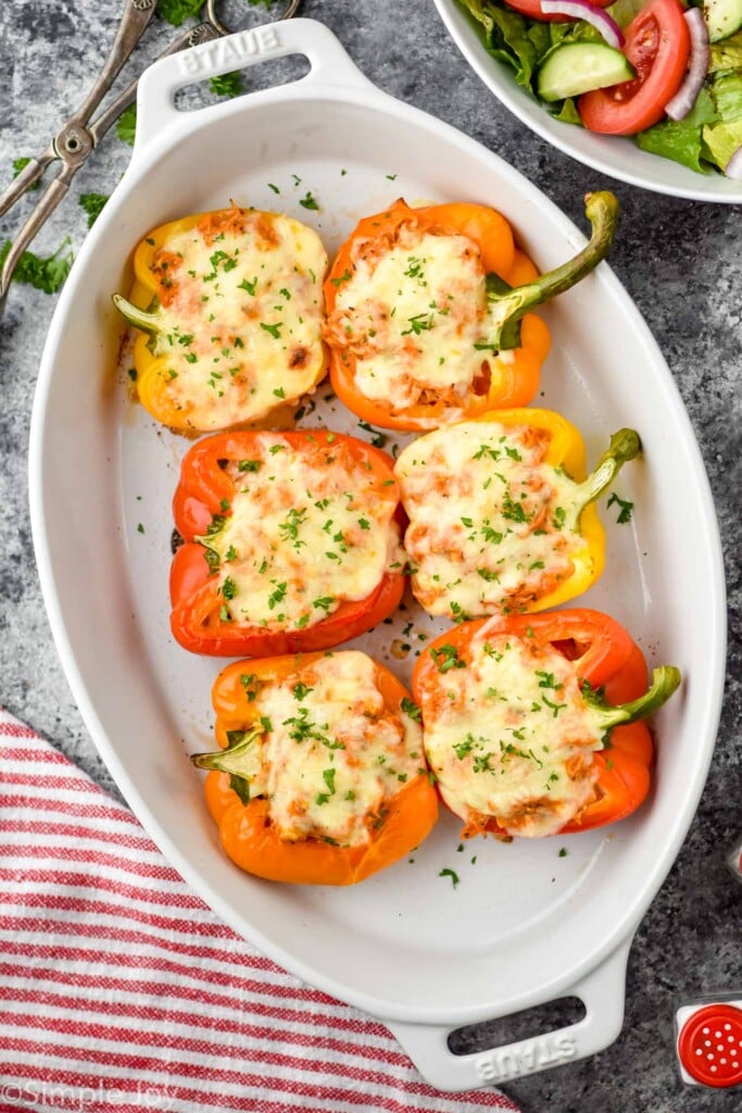 overhead of a casserole dish with chicken stuffed peppers