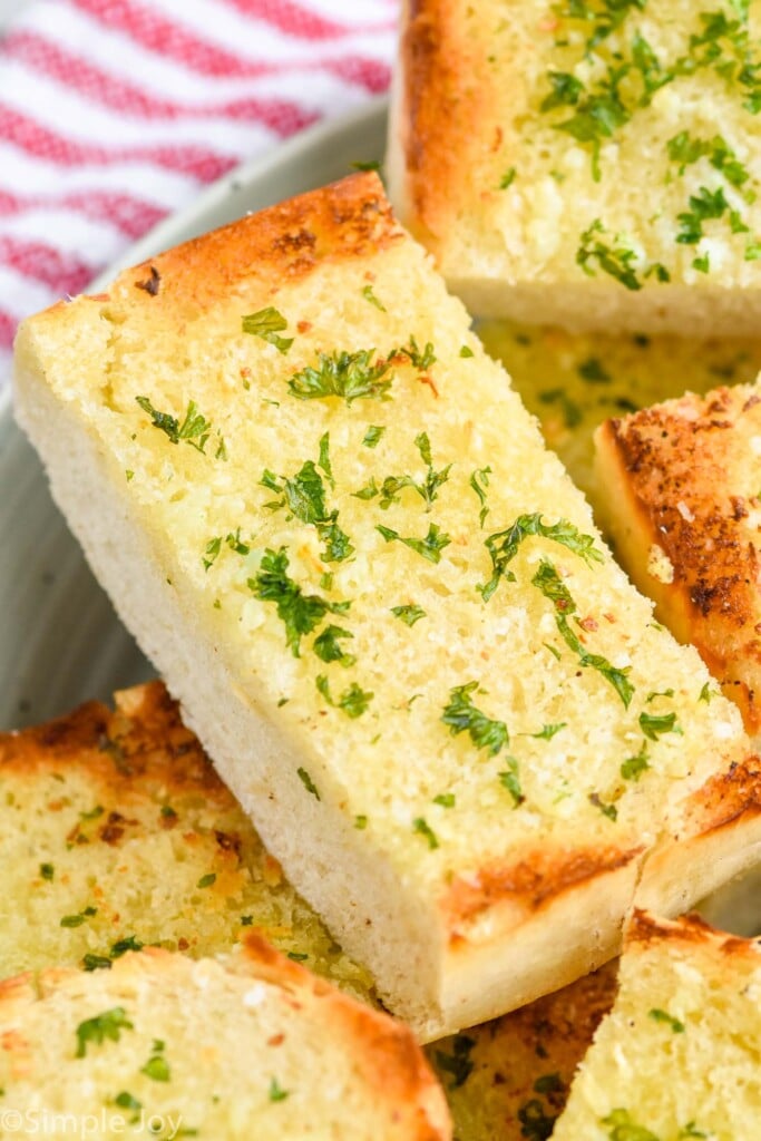 close up of a piece of easy garlic bread