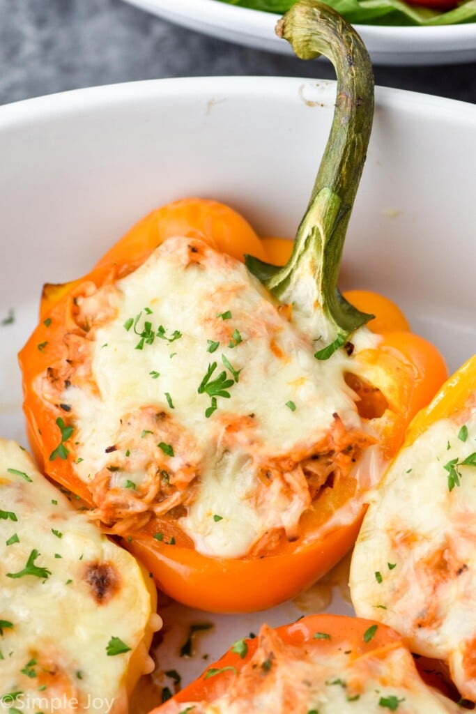 close up of a stuffed chicken pepper in a casserole dish