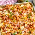 pinterest graphic of a sheet pan full of chicken nachos recipe made with bbq chicken