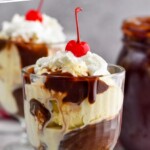 pinterest graphic of a hot fudge sundae in a glass with whipped cream and a cherry