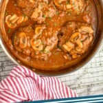 pinterest graphic of overhead of a skillet full of Salisbury steak