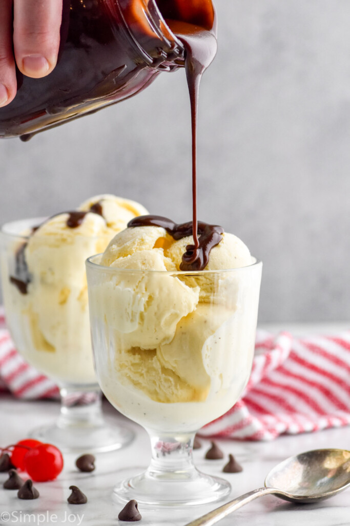 hot fudge being poured over ice cream