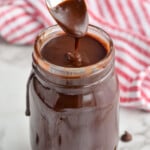 jar of hot fudge recipe with spoon dripping it in to the jar - 9