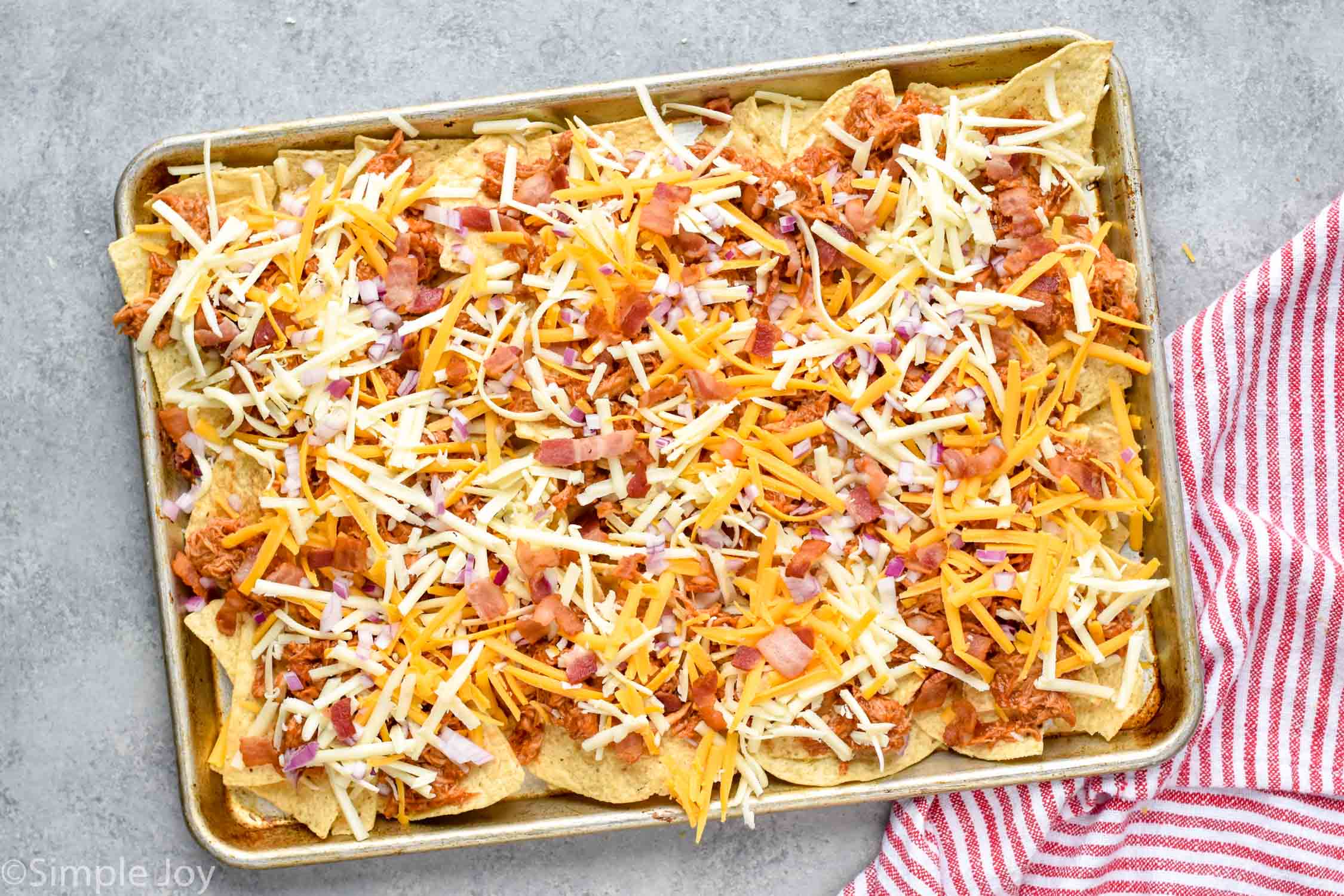 bbq chicken nachos before being baked