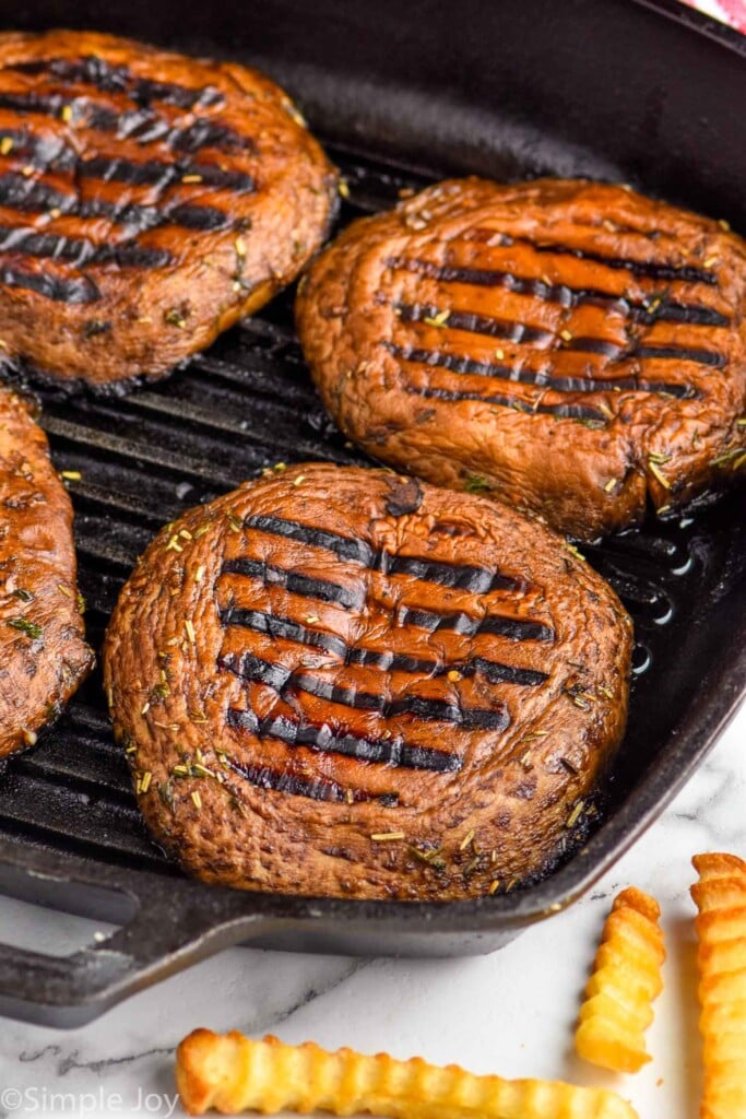 close up of a portobello mushroom burger grilled in a grill pan