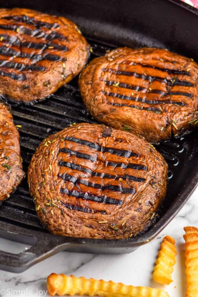 close up of a portobello mushroom burger grilled in a grill pan
