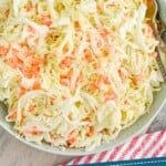 pinterest graphic of overhead bowl of coleslaw recipe in a big serving bowl says: "amazing coleslaw recipe simplejoy.com"