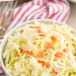 pinterst graphic of small white bowl full of coleslaw that says "must make coleslaw recipe simplejoy.com"
