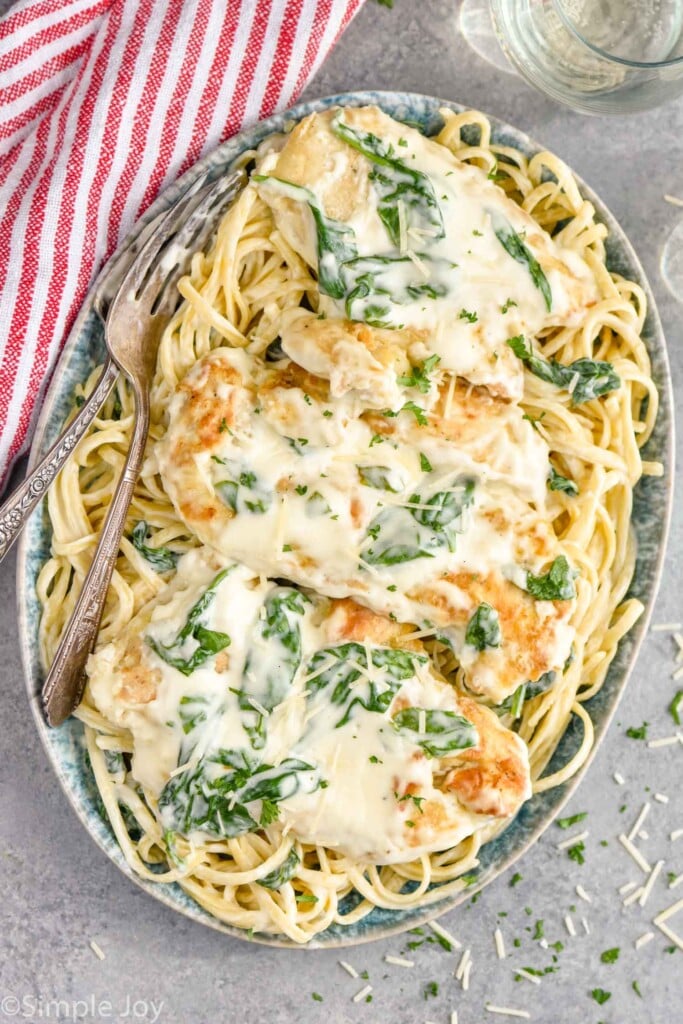 Overhead photo of chicken florentine recipe served on a plate with a fork.