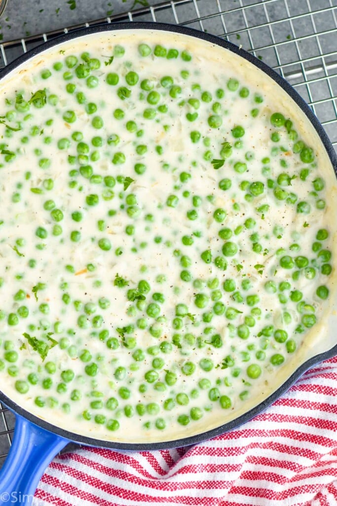 Overhead photo of creamed peas in a pan.