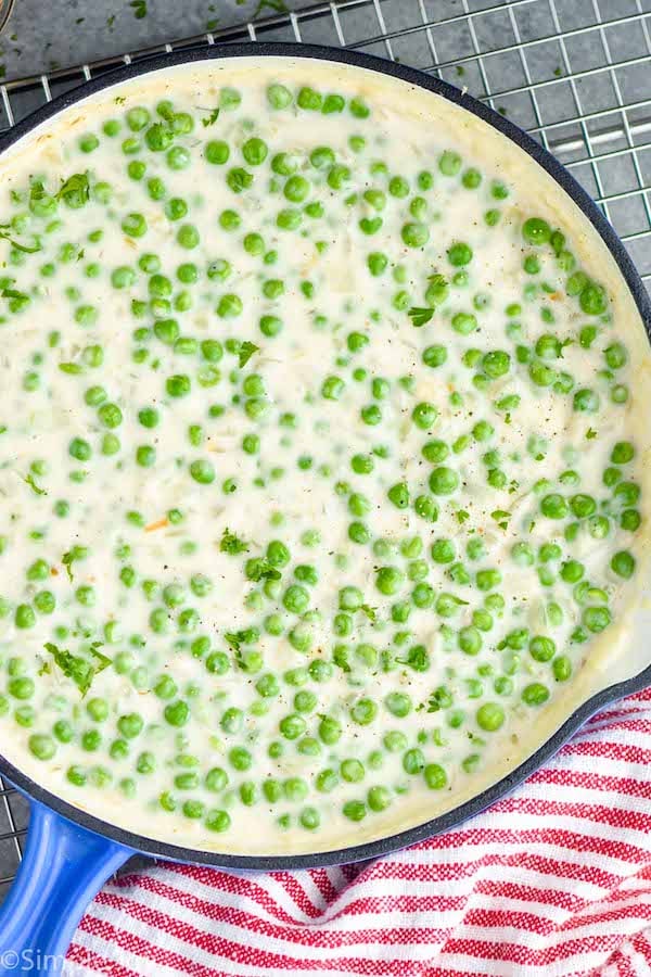 Overhead photo of creamed peas in a pan.