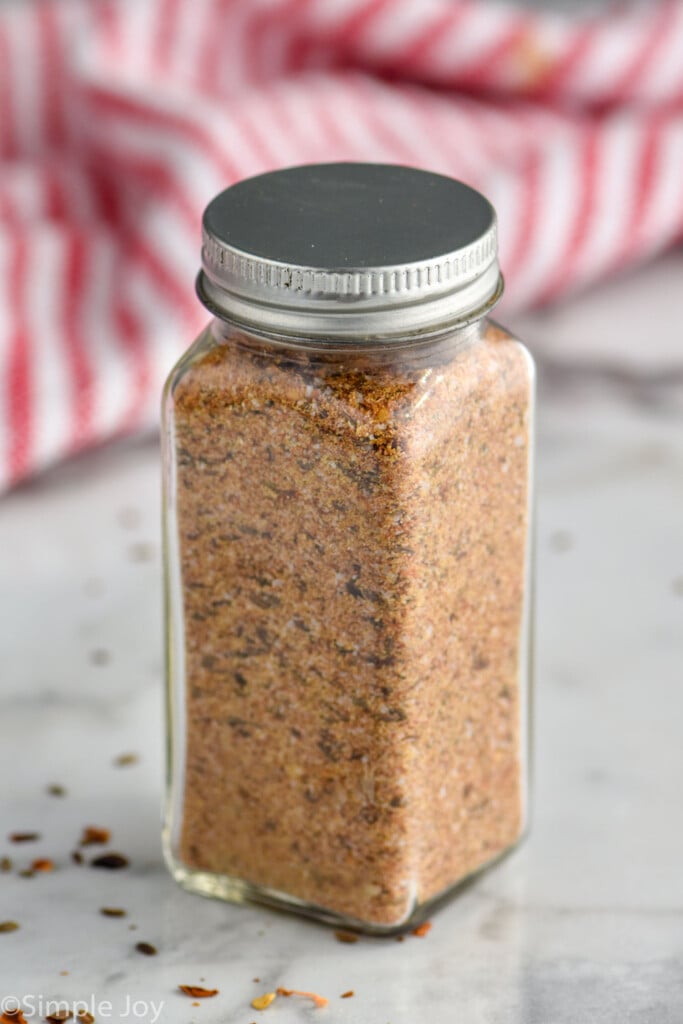 Montreal Steak Seasoning in a clear jar with tin lid.