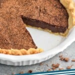 Pinterest graphic of chocolate chess pie. Overhead photo of chocolate chess pie with one slice taken out of the pie dish. Text says, "Chocolate chess pie simplejoy.com"