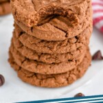 Pinterest graphic of chocolate peanut butter cookies recipe. Image is an overhead photo of a stack of chocolate peanut butter cookies with the top cookie missing a bite out of it. Text says, "Chocolate peanut butter cookies simplejoy.com"