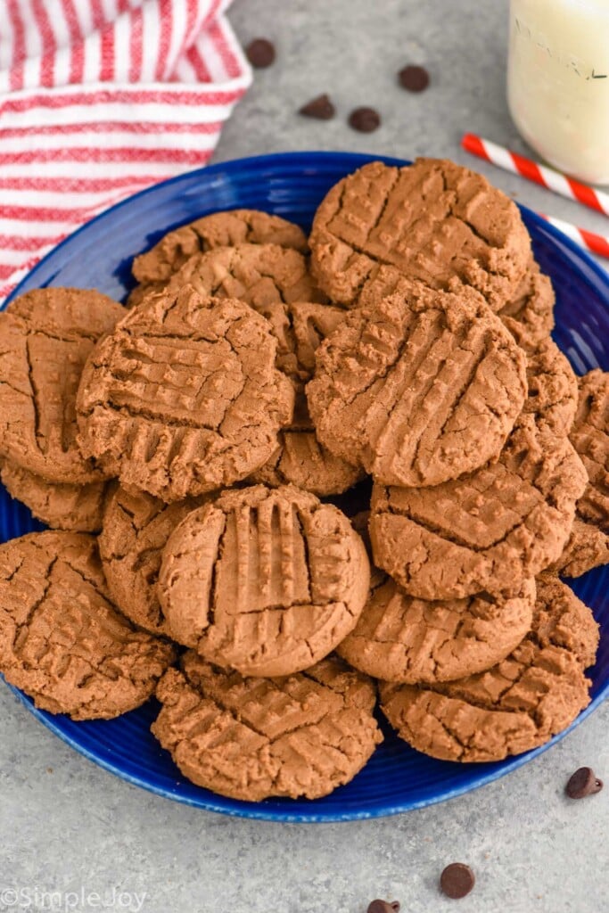 Overhead photo of chocolate peanut butter cookies on a plate.