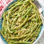 Overhead photo of Italian Green beans on a platter with forks for serving. - 10
