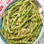 Overhead photo of Italian Green beans on a platter with forks for serving.