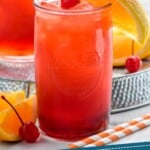 Pinterest graphic for Alabama Slammer recipe. Image is photo of Alabama Slammer in a glass, garnished with an orange slice, a cherry, and a straw. Text says, "The Best Alabama Slammer simplejoy.com"