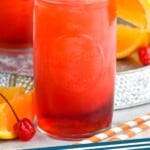 Pinterest graphic for Alabama Slammer recipe. Image is photo of Alabama Slammer in a glass, garnished with an orange slice, a cherry, and a straw. Text says, "Alabama Slammer simplejoy.com"