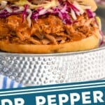 Pinterest graphic of Dr. Pepper Pulled Pork recipe. Image is photo of Dr. Pepper Pulled Pork sandwich garnished with slaw. Text says, "Dr. Pepper Pulled Pork simplejoy.com"