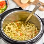 Pinterest graphic of instant pot chicken noodle soup recipe. Text says, "Instant pot chicken noodle soup simplejoy.com." Image is overhead photo of instant pot with instant pot chicken noodle soup recipe and a ladle for serving.