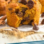 Pinterest graphic for Pumpkin Chocolate Chip Muffins recipe. Photo of Pumpkin Chocolate Chip Muffins with a bite taken out. Text says, "Pumpkin Chocolate Chip Muffins simplejoy.com"