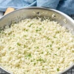 Overhead photo of cauliflower rice recipe in a skillet. - 14