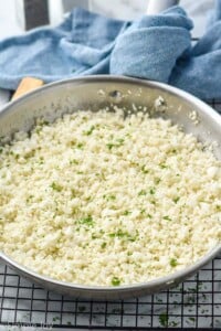 Overhead photo of cauliflower rice recipe in a skillet.