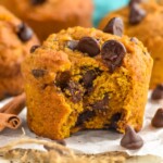 Photo of Pumpkin Chocolate Chip Muffins with a bite taken out.