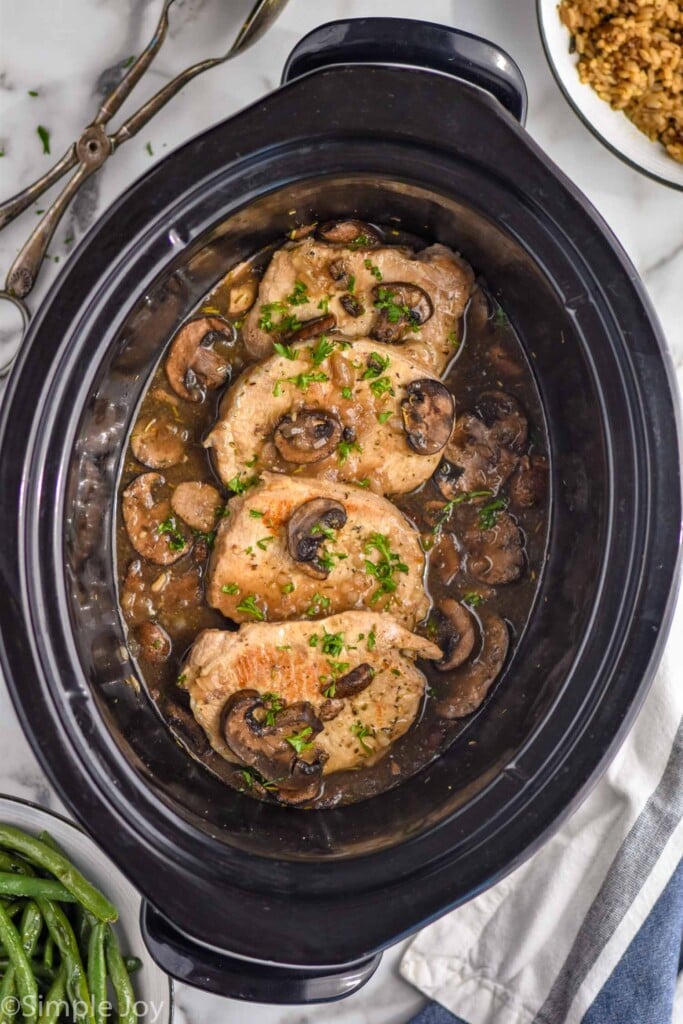 Overhead photo of crock pot pork chops recipe in a crock pot.