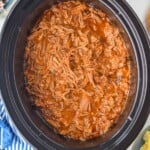 Overhead photo of Dr. Pepper Pulled Pork recipe in a crock pot.