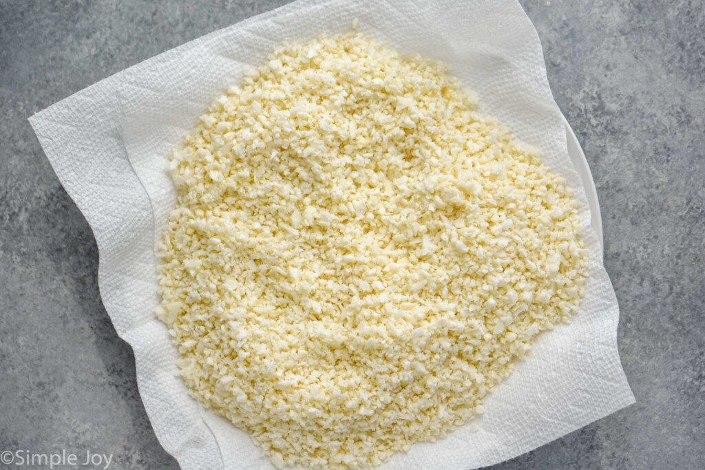 Overhead photo of cauliflower rice recipe on a paper towel lined plate.
