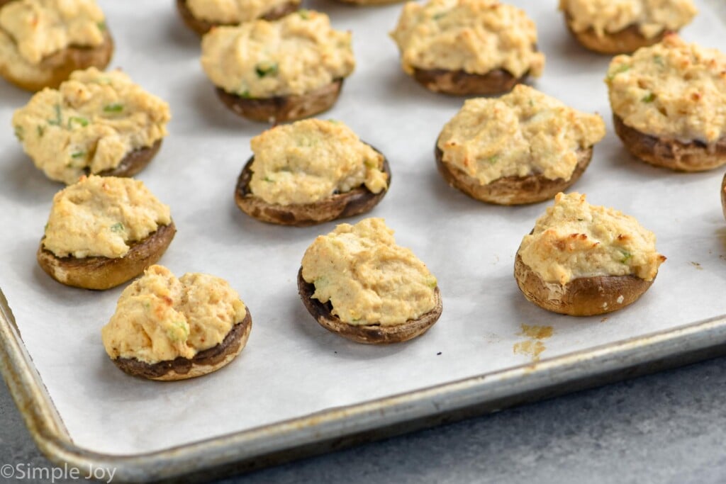 Overhead photo of Crab Stuffed Mushrooms on a baking sheet.