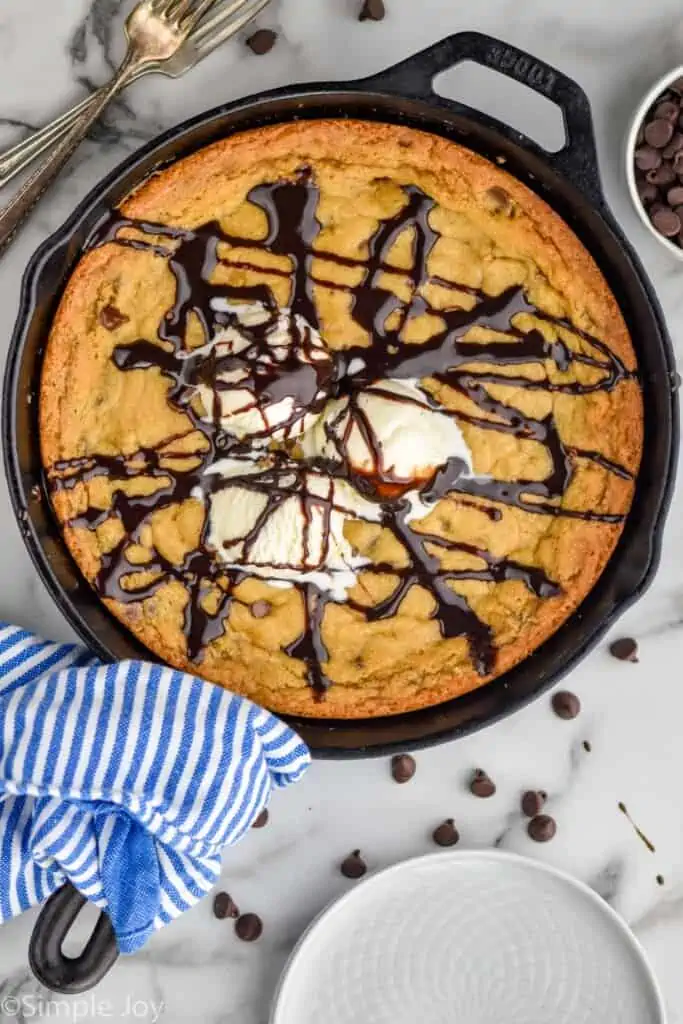 Overhead photo of Pizookie recipe garnished with ice cream and hot fudge sauce.