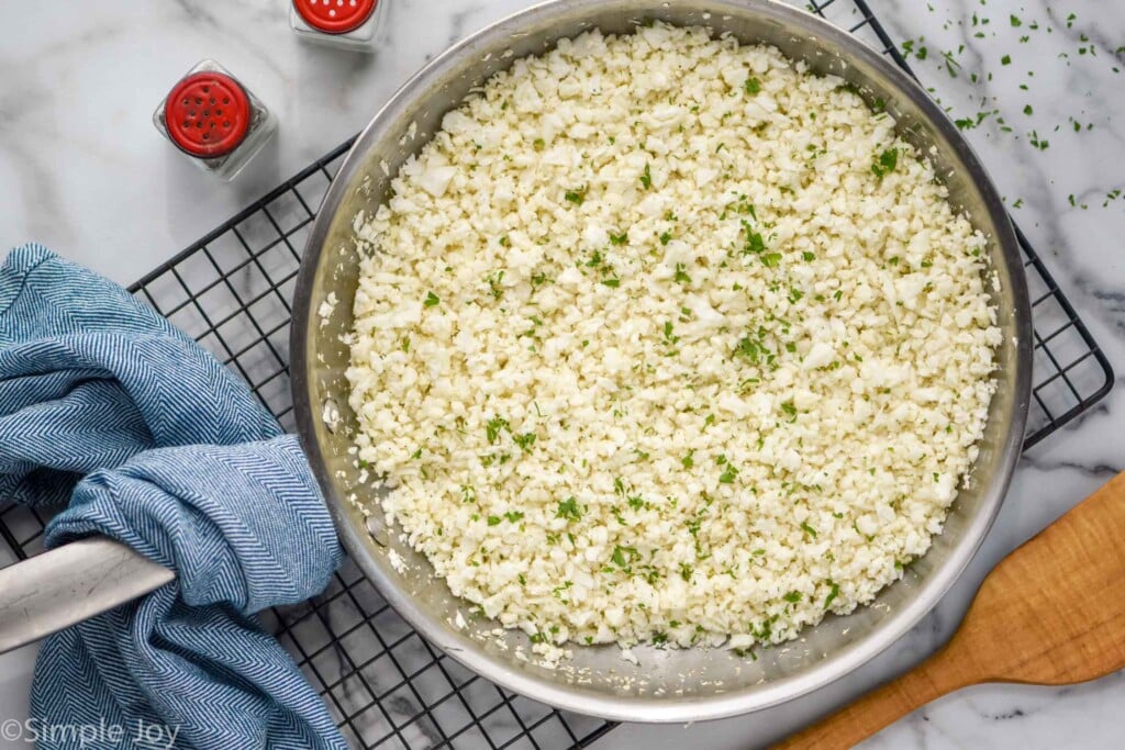 Overhead photo of cauliflower rice recipe in a skillet.
