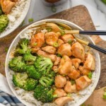 Overhead photo of teriyaki chicken bowl served with broccoli over rice and two forks for eating.